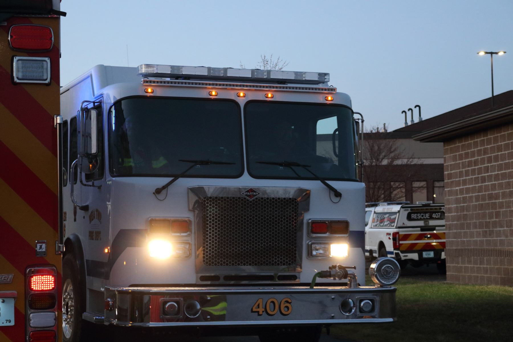 Front of Tanker 406 with its lights on at dusk